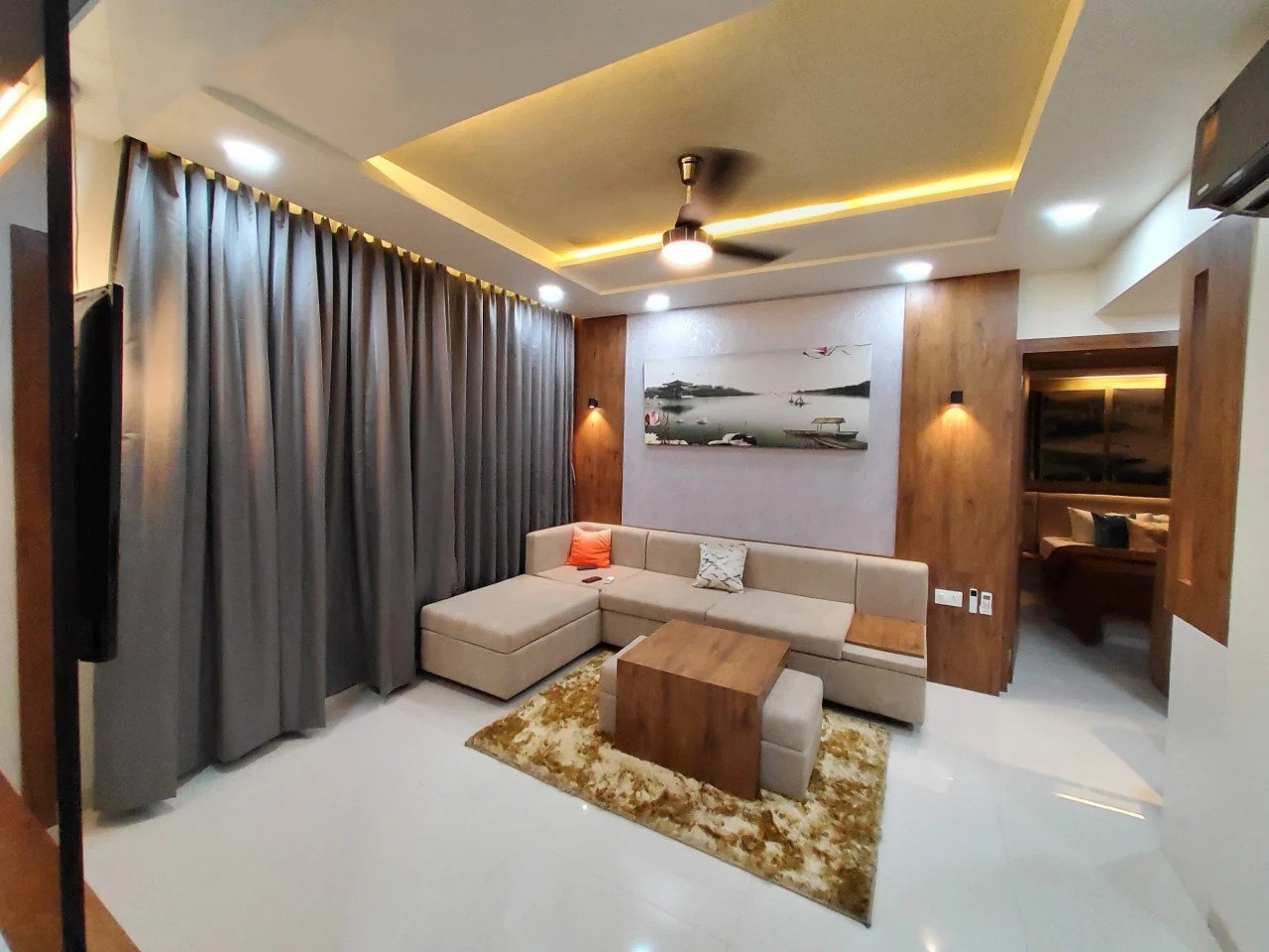 Dark, textural living room with a walnut media wall